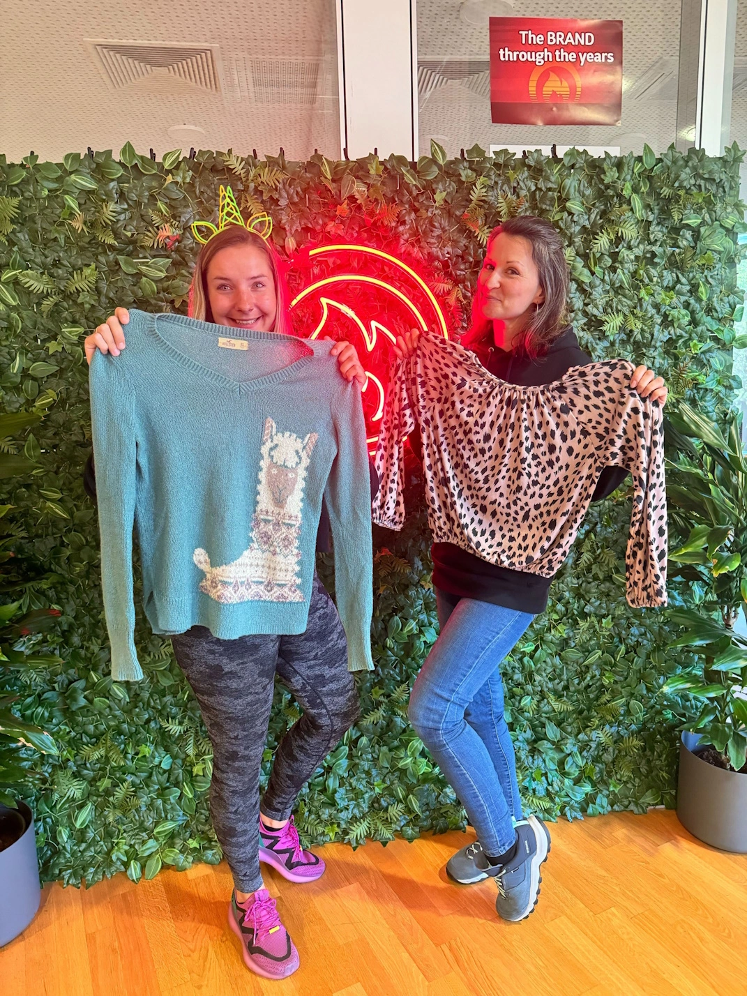 Two team members Showing some clothing items